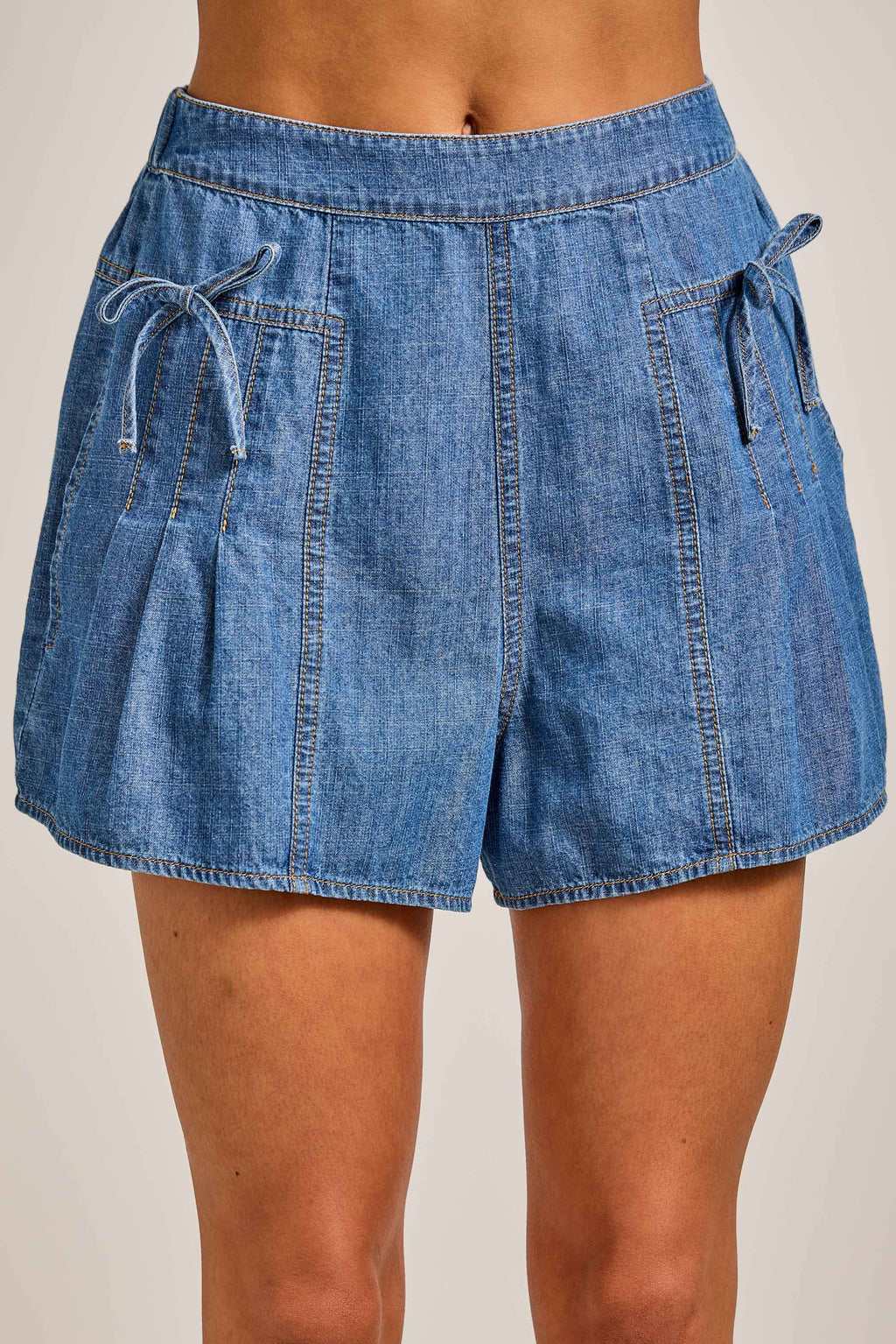 Denim Pleated Shorts with Bow Tie Detail: DENIM / S